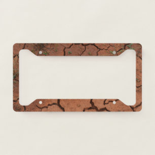 dry, cracked ground license plate frame