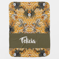 Dry flowers and leaves on orange baby blanket