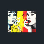 Dual pop art portrait canvas print<br><div class="desc">Two women are depicted in a vibrant, pop art style, one in shades of blue and yellow and the other in grayscale with bold red lipstick. The background features a mix of abstract patterns in red and yellow tones.</div>