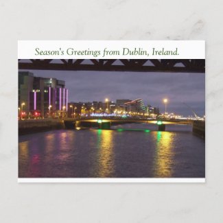 Dublin Ireland Christmas postcard with lights on River Liffey at IFSC & Dublin Port