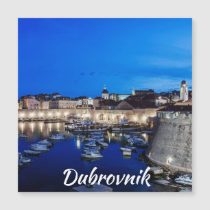 Dubrovnik harbor and walls illuminated at night ma
