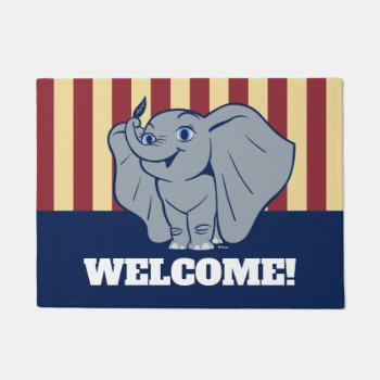 Dumbo | Cartoon Dumbo Holding Up Feather Doormat by dumbo at Zazzle