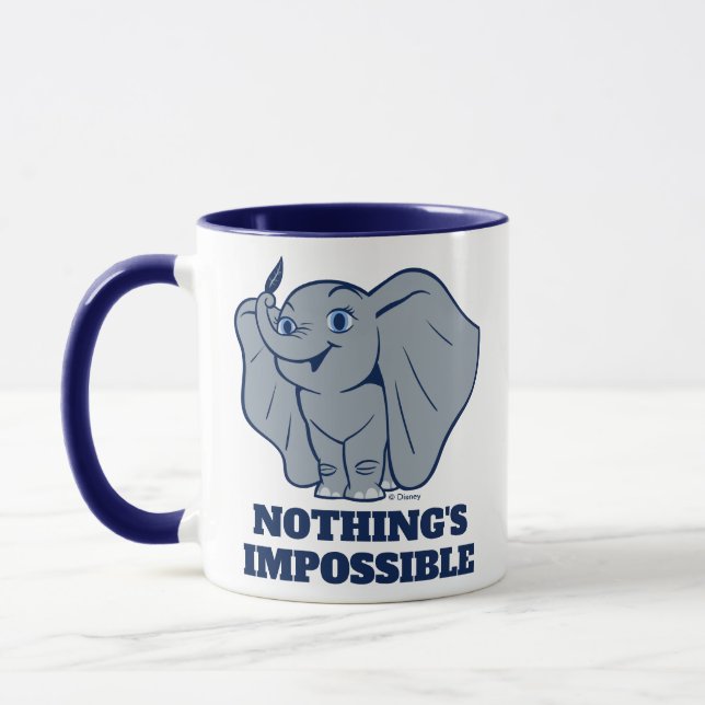 Dumbo | Cartoon Dumbo Holding Up Feather Mug (Left)