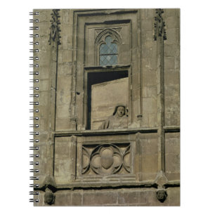 Dummy window in the entrance facade with a figure notebook