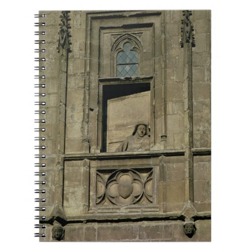 Dummy window in the entrance facade with a figure notebook