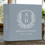 Dusty Blue Crest Modern Monogram Wedding<br><div class="desc">Organize your wedding plans in style with the Modern Monogram Wedding Floral Crest 3-Ring Binder. Featuring a chic floral crest design, this binder is perfect for storing wedding documents, notes, and inspirations. Customize with your initials for a personalized touch. With its sturdy construction and elegant design, it serves as a...</div>