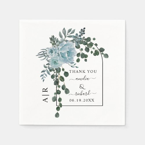 Dusty blue flowers arch and monogram wedding napkins