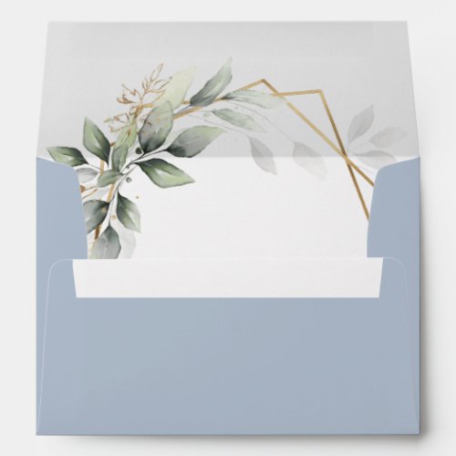 Dusty Blue Greenery Gold Geometric Rustic Wedding Envelope - Design features watercolor airy mixed greenery foliage and branches in various shades of green with printed gold design leaf elements over a gold colored geometric frame on the interior with a dusty blue (color code: #B2BFCF) exterior shade with a white return address.