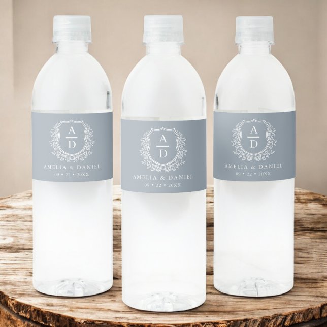 Dusty Blue Monogram Botanical Wedding Floral Crest Water Bottle Label (Creator Uploaded)