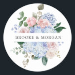 Dusty Blue Pastel Pink hydrangea Wedding Thank you Classic Round Sticker<br><div class="desc">Modern wedding thank you sticker featuring light blue/ dusty blue watercolor hydrangeas with pastel pink , blush, peach , white roses, peonies, sage eucalyptus leaves, branches and foliage. Muted soft and dreamy romantic shades spring summer watercolor floral designs to match with your themed wedding. Please find more matching designs and...</div>