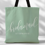 Dusty Mint Bridesmaid Modern Script Tote Bag<br><div class="desc">Show your appreciation to your bridal party with this stylish dusty mint green bridesmaid tote bag. Featuring modern script and customizable with your bridesmaid's name, this tote bag is both practical and elegant. The soft color and chic design make it perfect for carrying wedding day essentials or everyday items. This...</div>