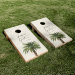 Dusty Palm | Wedding Event Minimal Style Tan Cornhole Set<br><div class="desc">A unique palm tree-themed set of cornhole boards tailored specifically to your future wedding on the beautiful coast or island. They feature a minimal style illustration of a single palm tree over a tan sandy color backdrop. Above this rest the unique names of the bride and groom in an elegant...</div>