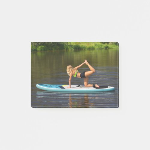 Dutch woman on SUP in yoga pose on water Post_it Notes