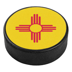 Dynamic New Mexico State Flag Graphic on a Hockey Puck