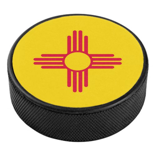 Dynamic New Mexico State Flag Graphic on a Hockey Puck