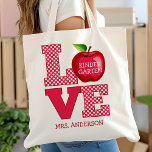 eacher Apple Love Personalized Name And Grade Tote Bag<br><div class="desc">Celebrate your favorite teacher with this adorable "Love" apple-themed tote bag, customizable with both a name and grade level. Perfect for kindergarten through high school teachers, this tote is a practical and stylish way to carry books, supplies, and daily essentials. Featuring a playful polka dot design and a bright red...</div>