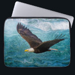 Eagle Soaring Above the Storm Laptop Sleeve<br><div class="desc">Carry your tech with confidence and inspiration with this striking laptop sleeve featuring a majestic bald eagle soaring above a stormy blue sea. The background swirls with abstract waves in deep navy, slate, and gray, evoking chaos and uncertainty—yet the eagle remains clear, focused, and unshaken. With outstretched wings and piercing...</div>