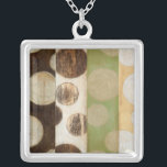 Earth Tone Wood Panel Painting with Circles Silver Plated Necklace<br><div class="desc">Created by Norman Wyatt, Jr., this painting was made utilizing the French process known as Giclee to spray ink droplets onto a canvas. Get lost in the concentric circles, the melding of earth tone colors across the painting, or the wood panel look of the piece. A great purchase for anyone...</div>