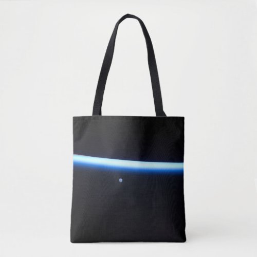 Earths Thin Line Of Atmosphere And A Gibbous Moon Tote Bag