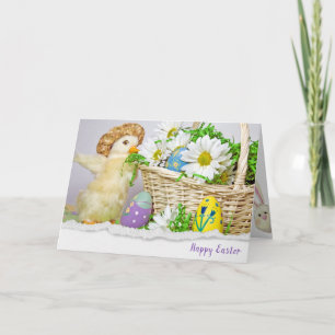 Easter eggs in basket with duckling card