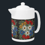 Edelweiss Swiss Alpine Flower Teapot<br><div class="desc">An image of a floral pattern with a needlework look of Edelweiss white Alpine flowers of Europe on your product. Blue,  red,  yellow,  and white colors. Leontopodium alpinum of Switzerland,  Germany,  and Austria.</div>
