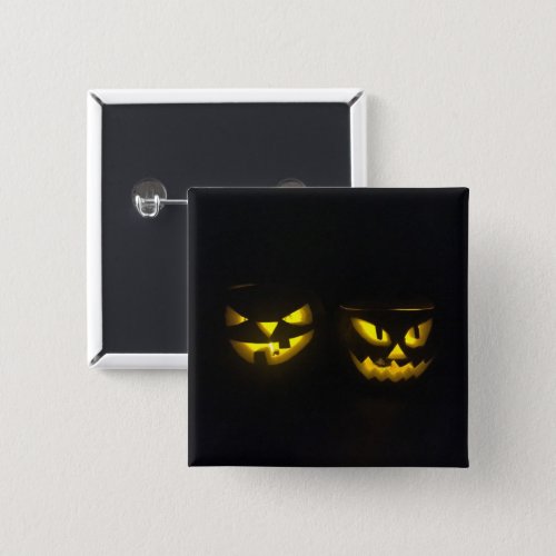 Eeire yellow glow on black creepy pumpkin faces button