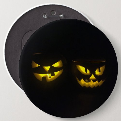 Eeire yellow glow on black pumpkin face button