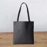 Eerie Black Solid Color Tote Bag<br><div class="desc">An intense and sophisticated deep black that exudes timeless elegance.Perfect for those seeking to make a bold statement.This powerful hue captures the essence of mystery and sophistication.This rich black color is the ultimate choice for a striking and refined aesthetic.</div>
