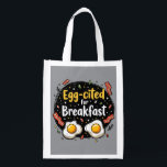 Egg-cited for Breakfast Funny Foodie Pun Design Grocery Bag<br><div class="desc">Start your morning with a smile with this playful "Egg-cited for Breakfast" design, perfect for food lovers and brunch enthusiasts alike. Featuring a charming hand-drawn style, this artwork showcases two sunny-side-up eggs alongside crispy bacon strips, all set against a whimsical backdrop of scattered seasonings and vibrant typography. The warm yellow...</div>