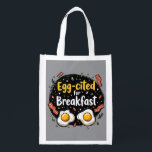 Egg-cited for Breakfast Funny Foodie Pun Design Grocery Bag<br><div class="desc">Start your morning with a smile with this playful "Egg-cited for Breakfast" design, perfect for food lovers and brunch enthusiasts alike. Featuring a charming hand-drawn style, this artwork showcases two sunny-side-up eggs alongside crispy bacon strips, all set against a whimsical backdrop of scattered seasonings and vibrant typography. The warm yellow...</div>