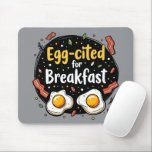 Egg-cited for Breakfast Funny Foodie Pun Design Mouse Pad<br><div class="desc">Start your morning with a smile with this playful "Egg-cited for Breakfast" design, perfect for food lovers and brunch enthusiasts alike. Featuring a charming hand-drawn style, this artwork showcases two sunny-side-up eggs alongside crispy bacon strips, all set against a whimsical backdrop of scattered seasonings and vibrant typography. The warm yellow...</div>