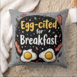 Egg-cited for Breakfast Funny Foodie Pun Design Throw Pillow<br><div class="desc">Start your morning with a smile with this playful "Egg-cited for Breakfast" design, perfect for food lovers and brunch enthusiasts alike. Featuring a charming hand-drawn style, this artwork showcases two sunny-side-up eggs alongside crispy bacon strips, all set against a whimsical backdrop of scattered seasonings and vibrant typography. The warm yellow...</div>