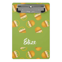 Eggs in brown basket on green