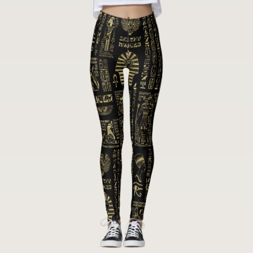 Egyptian hieroglyphs and deities gold on black leggings