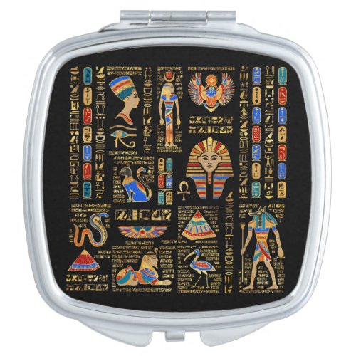 Egyptian hieroglyphs and deities on black compact mirror