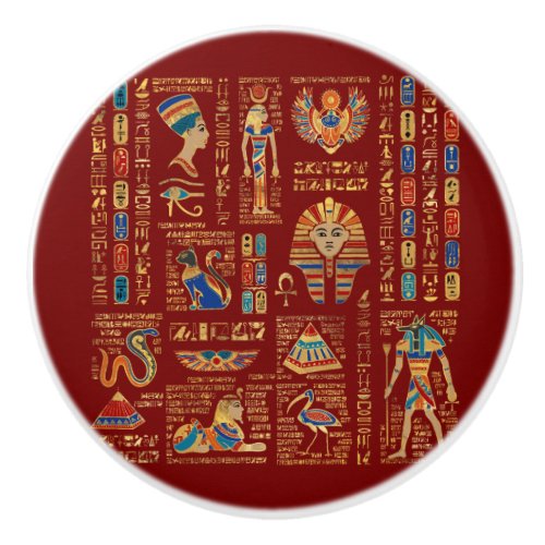 Egyptian hieroglyphs and deities on red ceramic knob