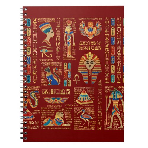 Egyptian hieroglyphs and deities on red notebook