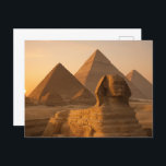 Egyptian Postcard Sphinx Pyramids Golden Hour<br><div class="desc">Witness the divine beauty of ancient Egypt with this breathtaking postcard featuring the legendary Sphinx and Pyramids of Giza bathed in mesmerizing golden sunset light. The captivating warm glow transforms these sacred monuments into an ethereal vision of eternal majesty. Perfect for Egypt enthusiasts, photography lovers, and sunset collectors seeking stunning...</div>
