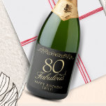 Elegant 80 and Fabulous Ornament 80th Birthday Sparkling Wine Label<br><div class="desc">Elegant 80 and Fabulous Ornament 80th Birthday Sparkling Wine Label. 80 and fabulous text in trendy golden script and an elegant ornament on black background. Personalize it with your name and your age,  and make personalized elegant wine labels for a birthday party.</div>
