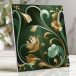 Elegant Art Nouveau Floral Emerald and Gold Ceramic Tile<br><div class="desc">Add timeless sophistication to your space with this elegant Art Nouveau-inspired tile. Featuring deep emerald and gold tones, this design showcases flowing organic floral and vine patterns, intricate metallic accents, and stylized botanical curves. Perfect for creating luxurious backsplashes, accent walls, or vintage-inspired décor, this tile exudes charm and sophistication. Its...</div>