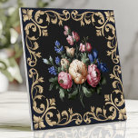 Elegant Black and Gold Floral Baroque Ceramic Tile<br><div class="desc">Enhance your décor with this luxurious tile featuring a stunning floral bouquet surrounded by ornate gold Baroque scrollwork on a rich black background. Perfect for backsplashes,  accent walls,  or creating a statement piece,  this design brings timeless sophistication and elegance to any space.</div>