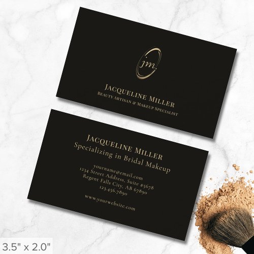 Elegant Black and Gold Monogram Makeup Artist Business Card