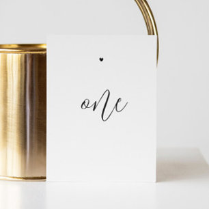 Elegant black and white minimalist script wedding table number