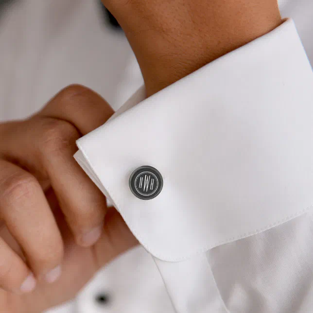 A customizable cufflink shown on the sleeve of a white shirt. 