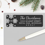 Elegant Black and White Snowflake Return Address Label<br><div class="desc">Holiday address labels feature a pattern of white snowflakes and dots with white return address and dark gray / soft black background. The background color can be customized to coordinate with your mailing.</div>