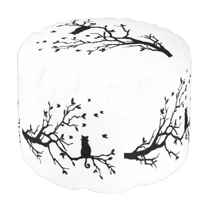 Elegant black cat in a tree pouf