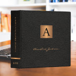 Elegant black gold monogrammed modern script name 3 ring binder<br><div class="desc">Stylish chic monogrammed office or school work organizer binder featuring a faux gold copper metallic square and dividers over a stylish solid black faux leather look (printed) background.                Suitable for small business,  home office,  corporate or independent business professionals,  school,  personal branding,  portfolios or stylists,  managers,  teachers,  students.</div>