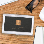 Elegant black gold monogrammed script name business card case<br><div class="desc">Trendy luxury exclusive looking monogrammed gold business card case featuring a faux gold square over a stylish classy black leather look (printed) background.             Personalize it with your white script signature name and monogram name initials.</div>