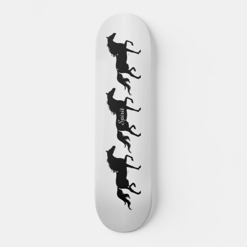 Elegant black horse silhouettes on gray gradient skateboard