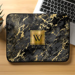 Elegant Black Marble Gold Brushed Metal Monogram Laptop Sleeve<br><div class="desc">This elegant laptop sleeve features a background pattern of black marble embellished with gold veins. Personalize it with your monogram initial in black on a gold brushed metal square.</div>